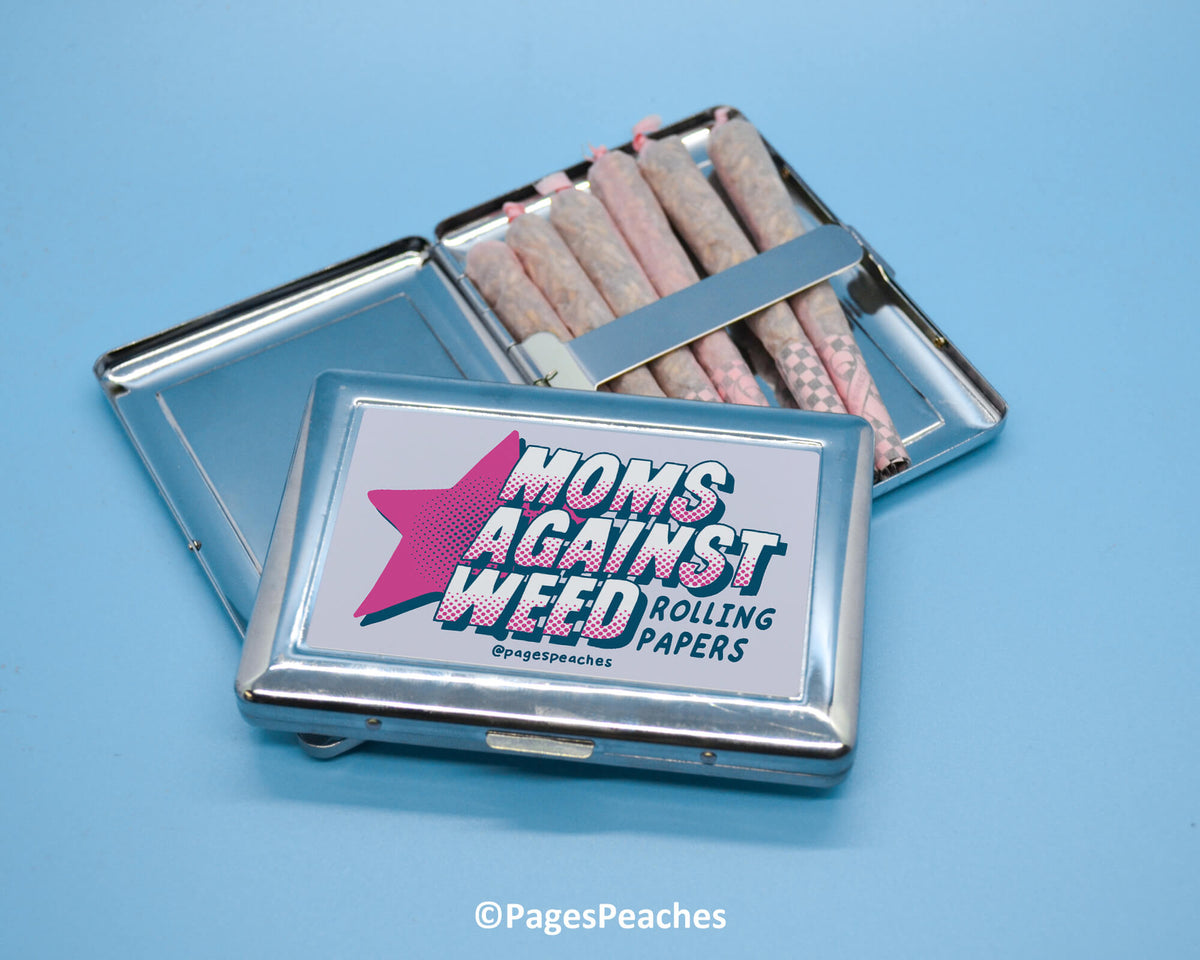 two tins of candy sitting on top of a blue table