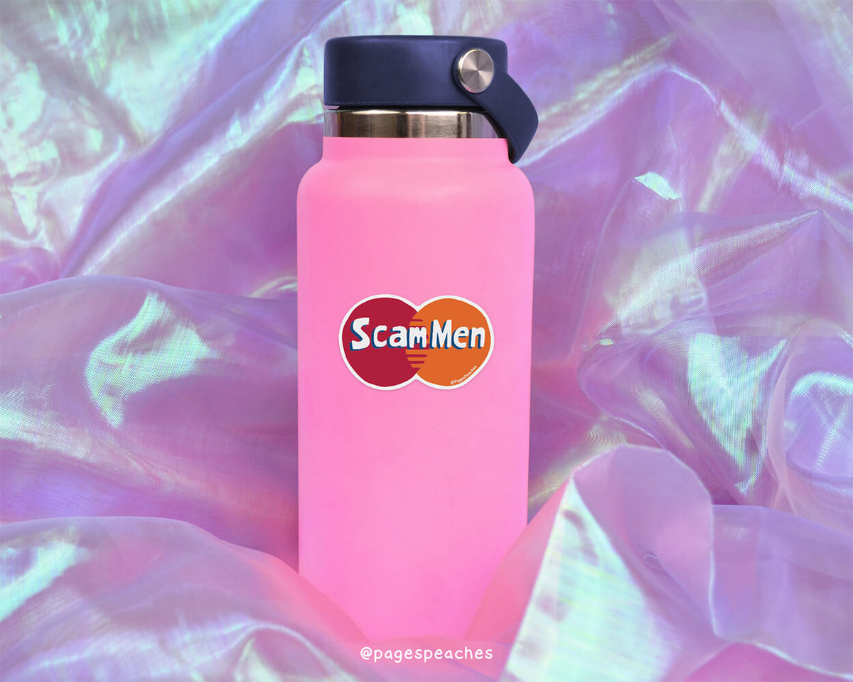 A pink water bottle with a black cap and a sticker that says &quot;ScamMen&quot; is placed on a purple fabric background.