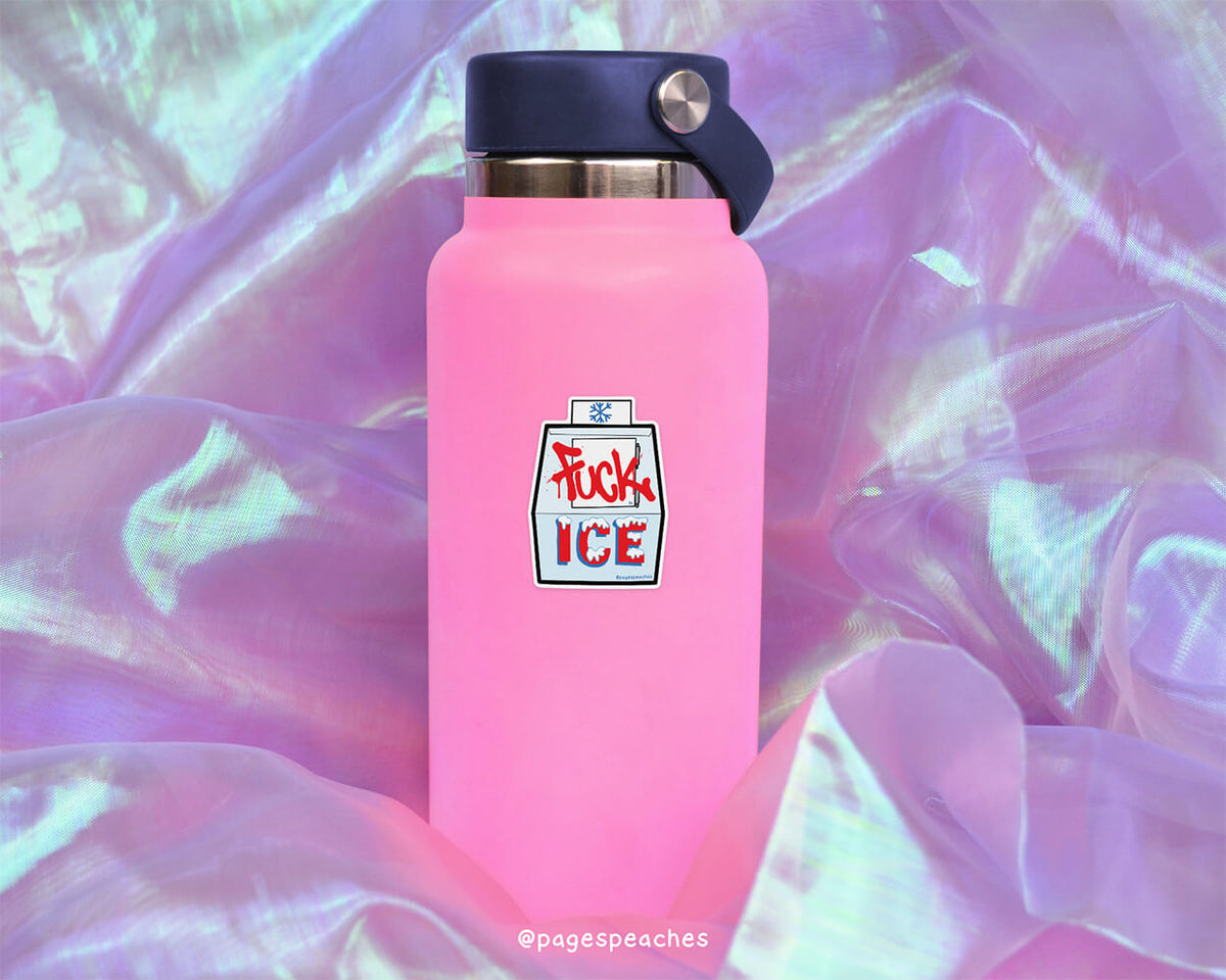 A pink water bottle with a black cap and a sticker that says &quot;FUCK ICE&quot; is placed on a purple fabric background.