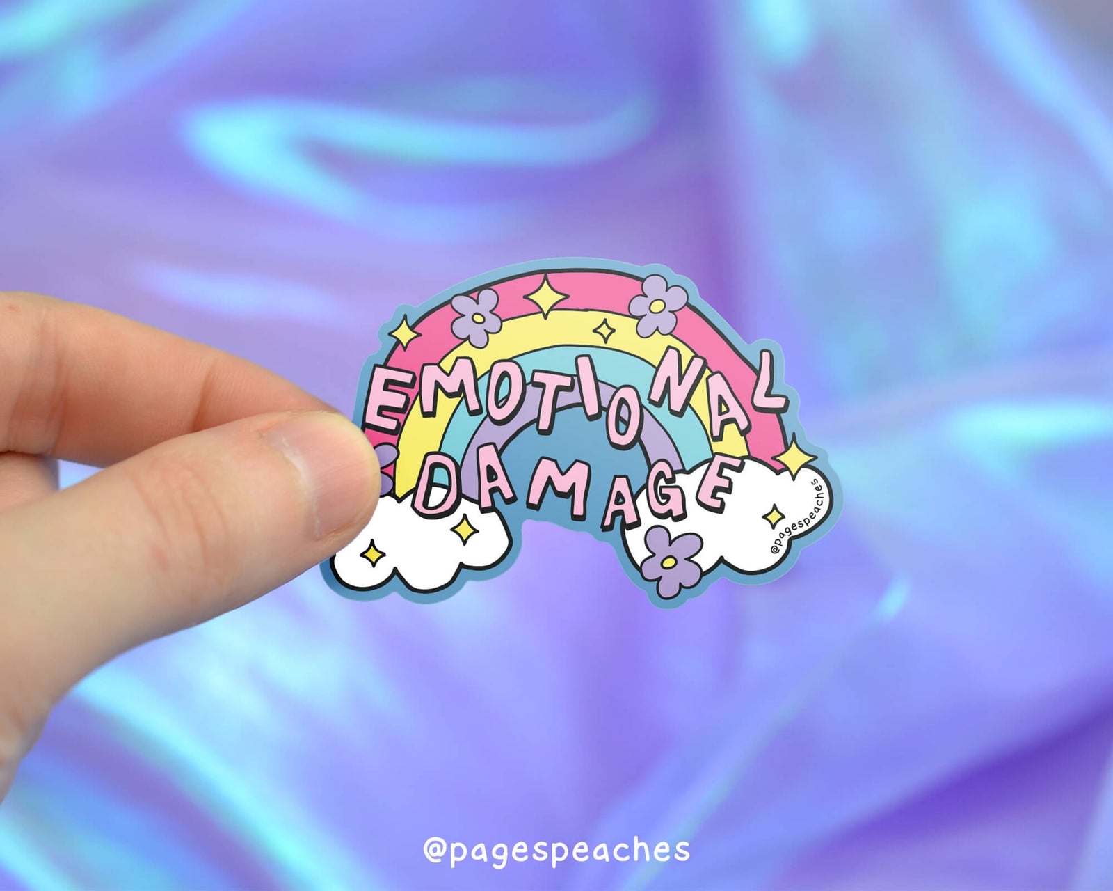 Sticker with 'Emotional Damage' text on a colorful background, held by a hand.