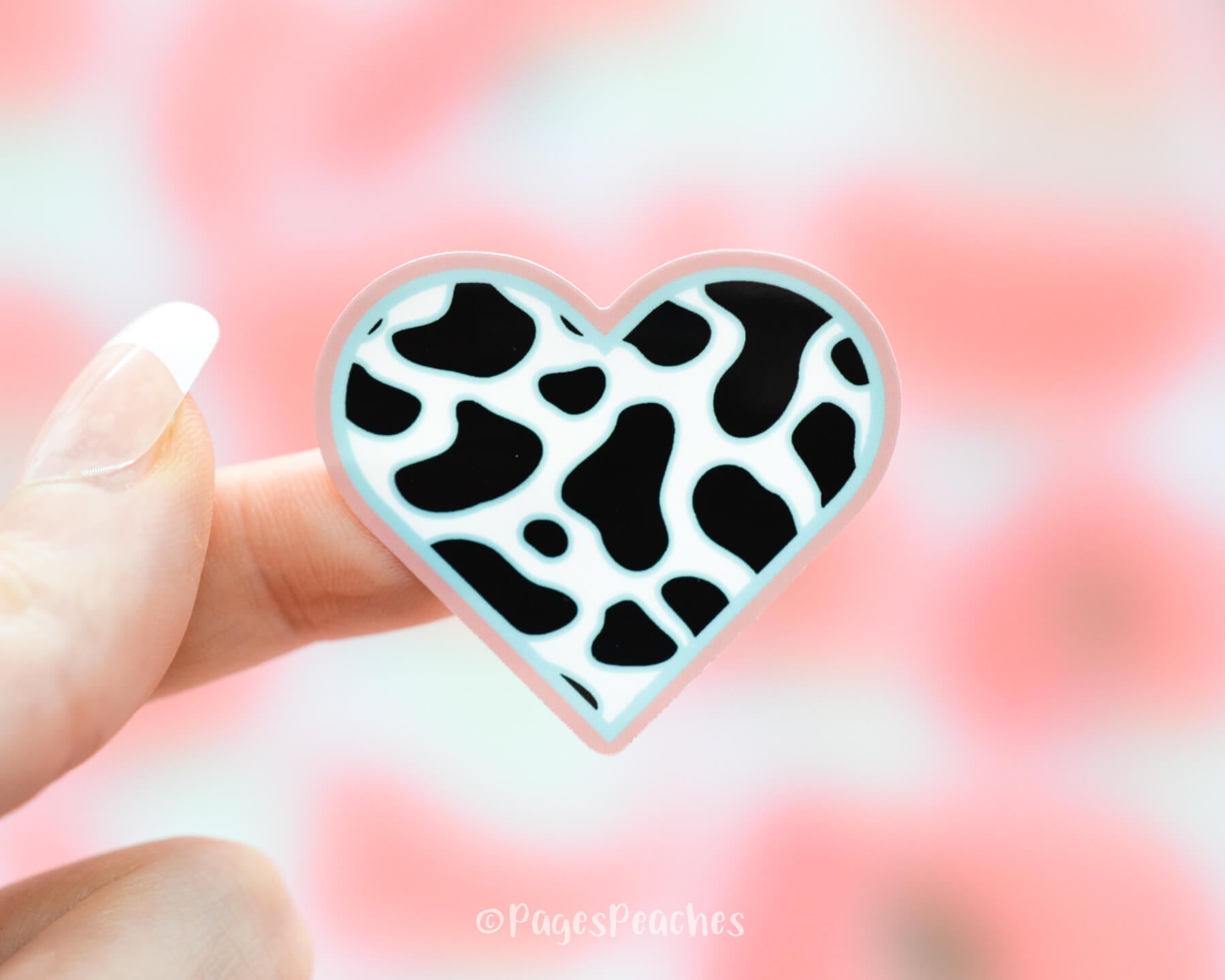 Sticker of a Heart with cow print inside of it