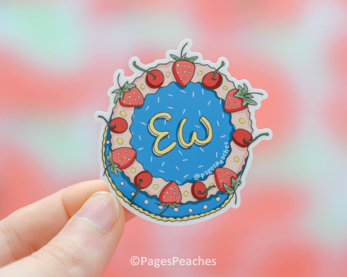 A waterproof sticker of a cake that says ew