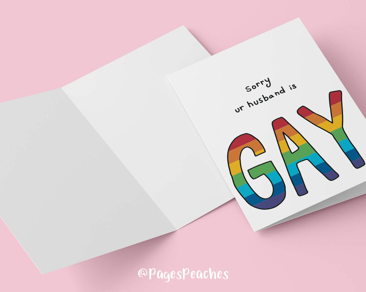 A white card that says sorry your husband is gay with the gay in rainbow colors for an LGBTQ wedding gift