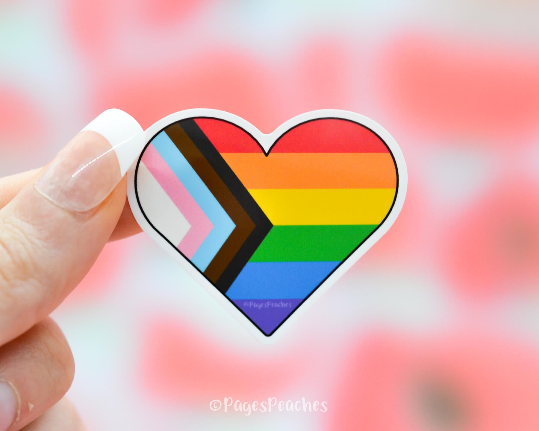 Sticker of an inclusive LGBTQ progress pride flag shaped in a heart
