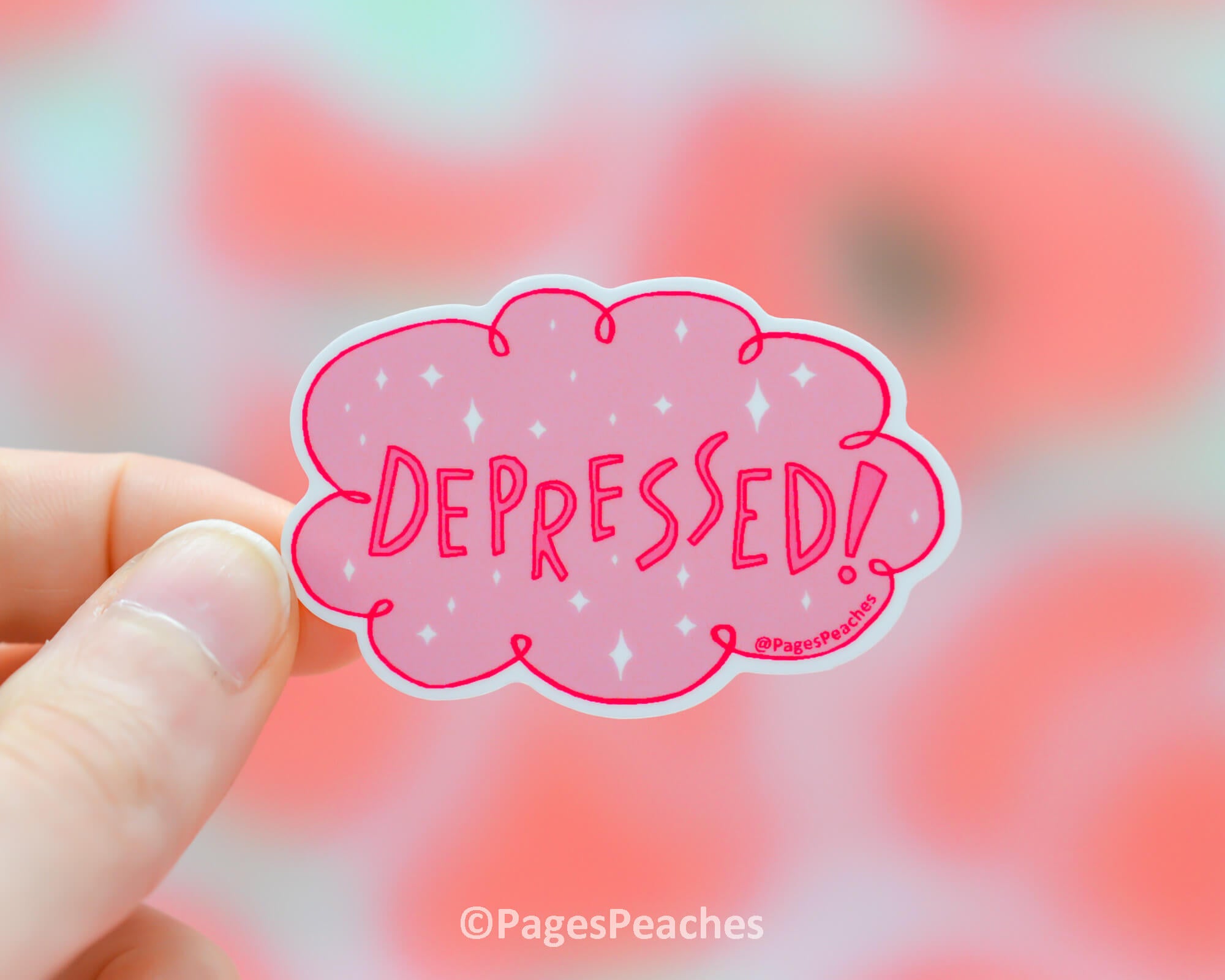 A pink waterproof sticker of a cloud that says depressed!
