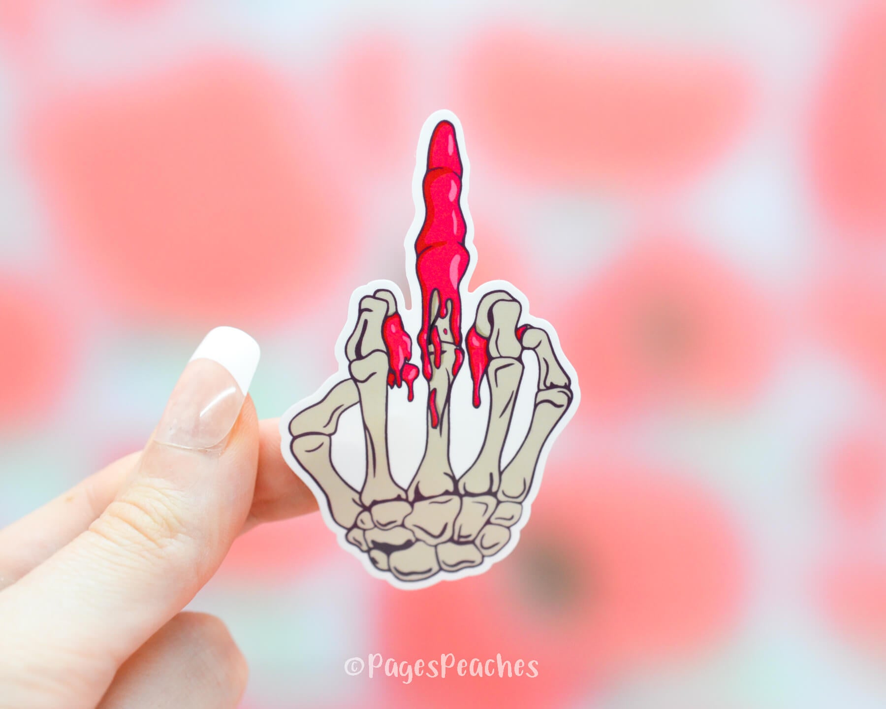 Sticker of a skeleton hand flipping off saying Fuck you with a bloody middle finger