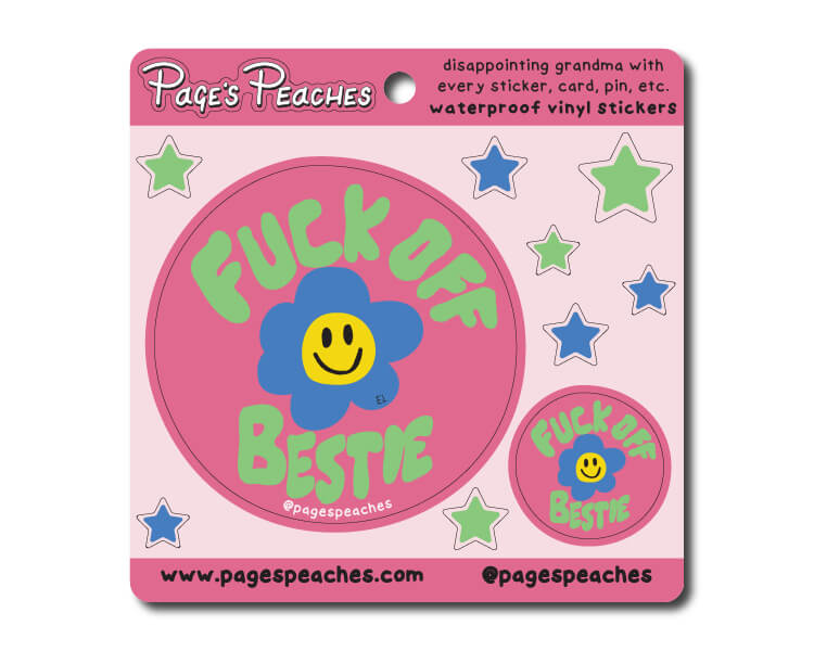 a pink sticker with a smiley face on it